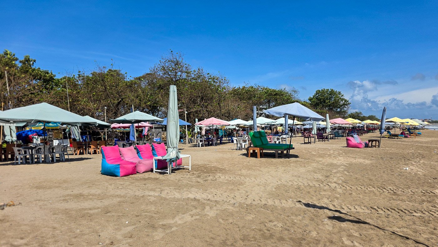 Empty beach with neatly arranged chairs before visitors arrive