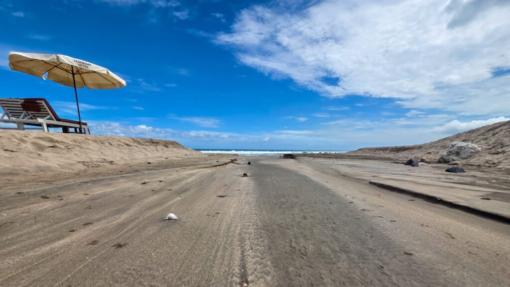 Dry water channel leading from Seminyak Beach into the ocean, symbolizing shifting paths in search.