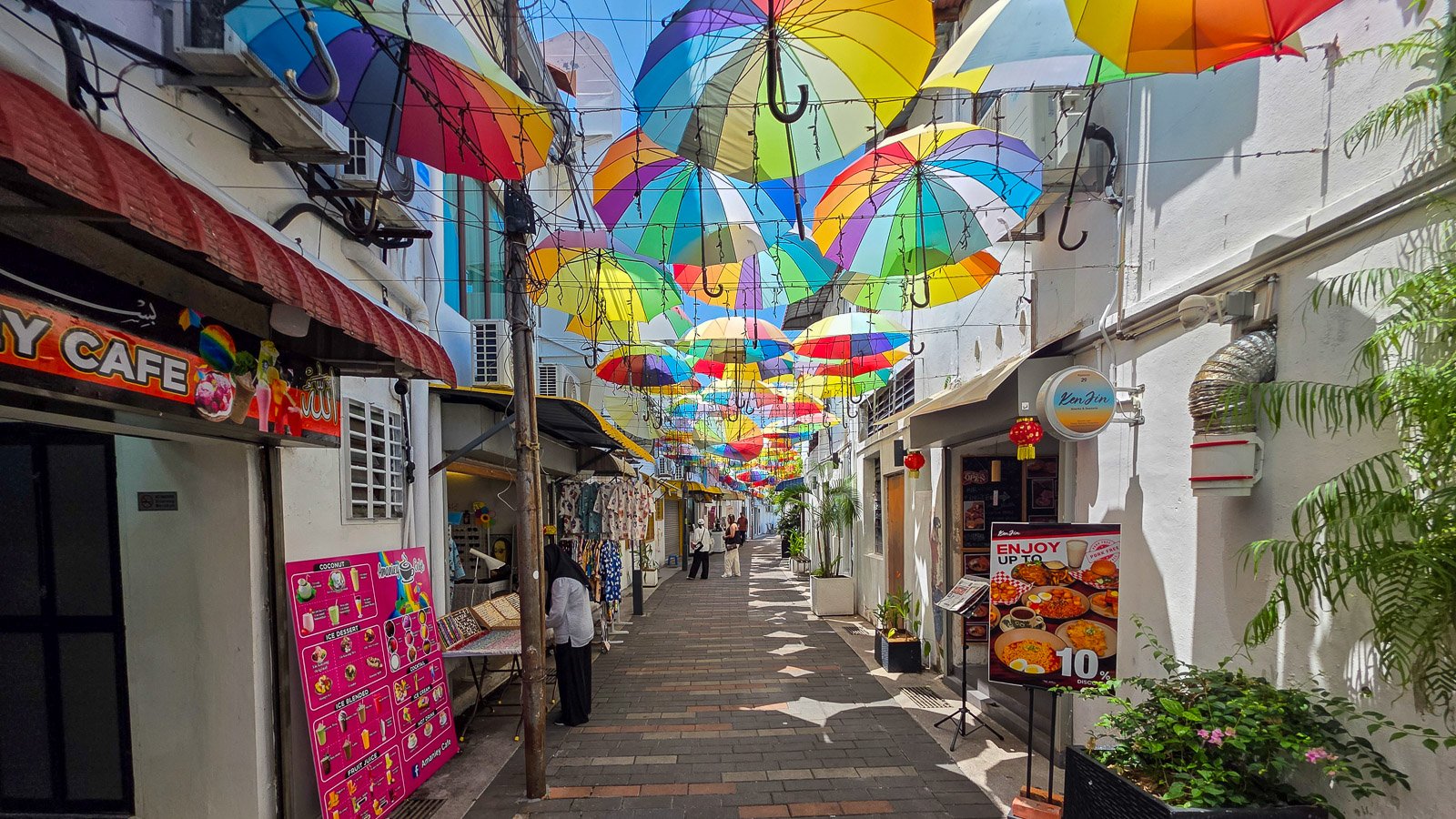 Person in foreground with shifting activity behind them in a busy environment