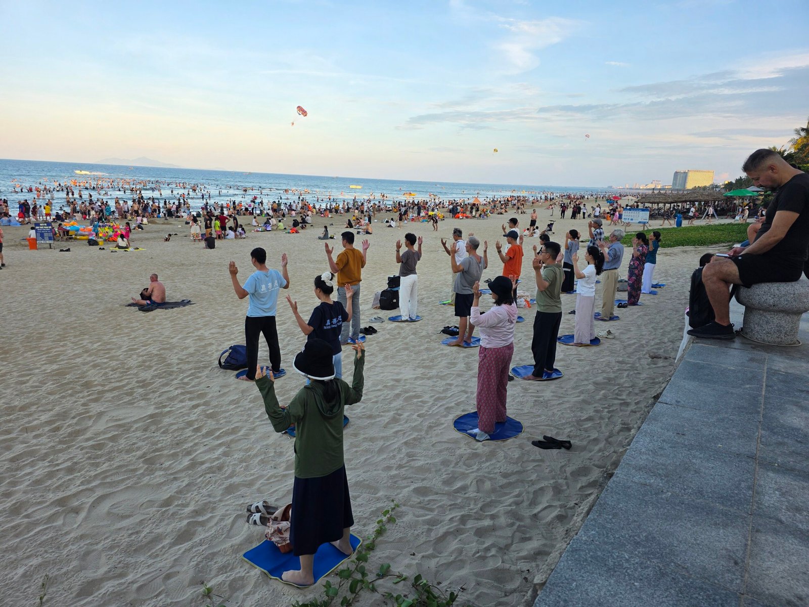 People exercising together on the beach in Da Nang, Vietnam